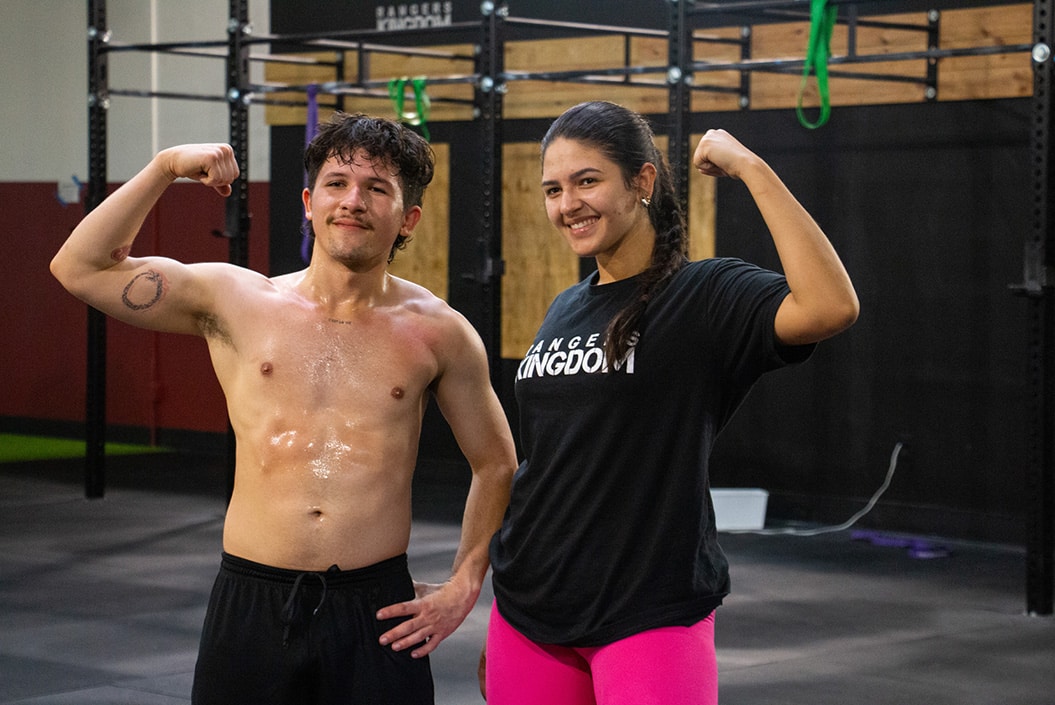 One man and one woman flexing together inside Rangers Kingdom located at Dezerland Park