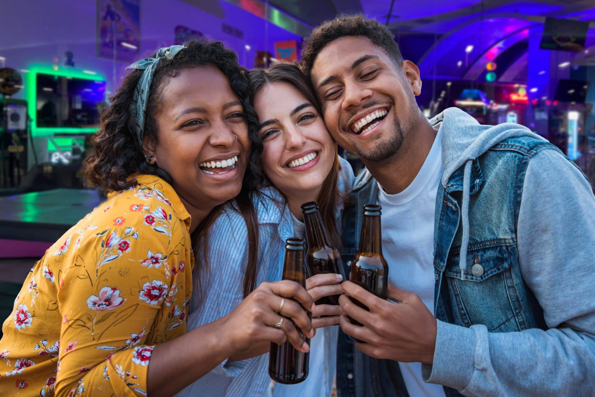 Three friends enjoying the pinball palace happy hour promotion