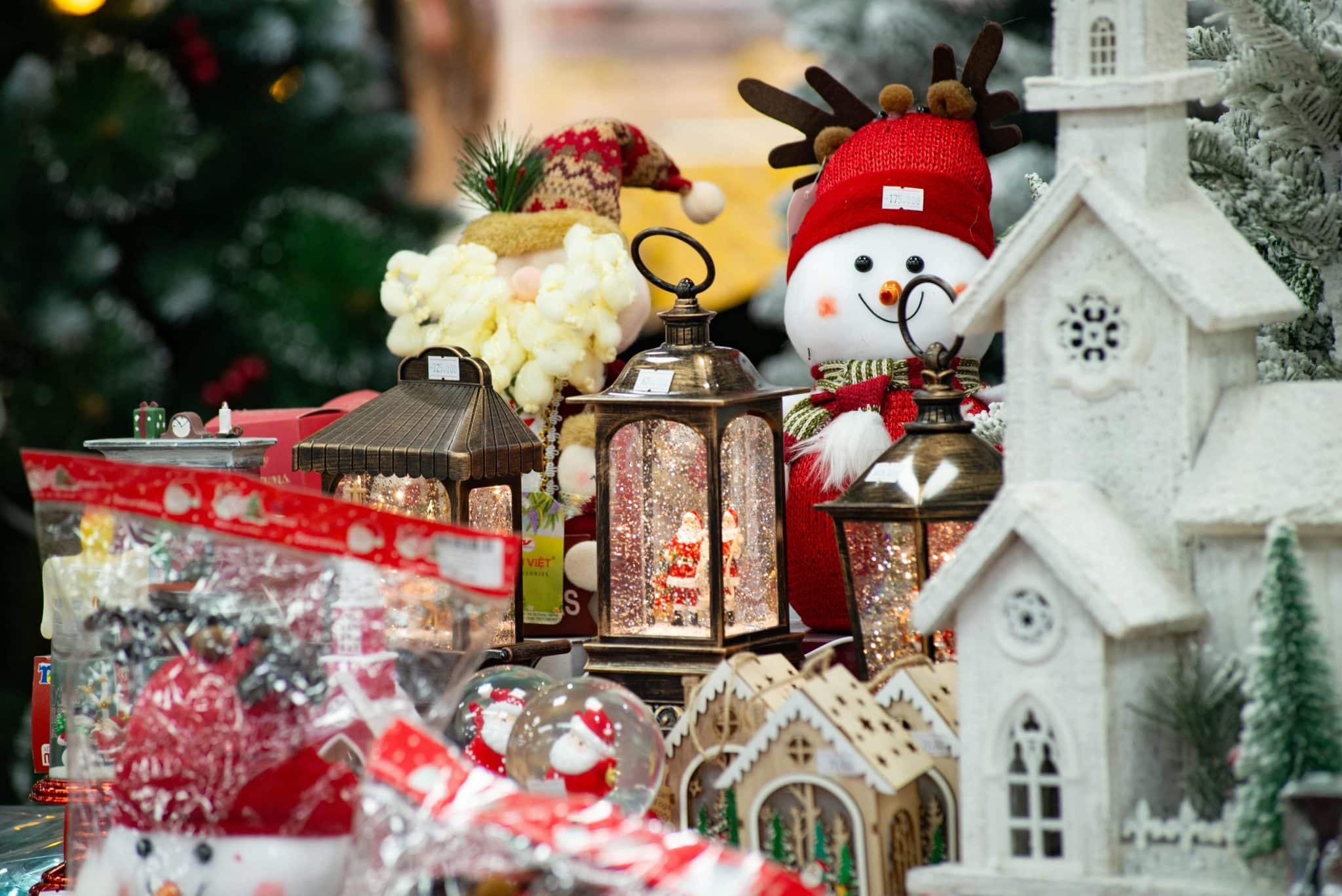 Christmas decorations featuring snowmen, lanterns, and festive ornaments create a warm holiday atmosphere.